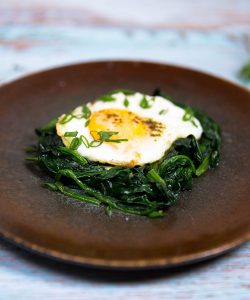 baked eggs with wilted baby spinach